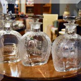 G03. Etched glass liquor decanters. 
